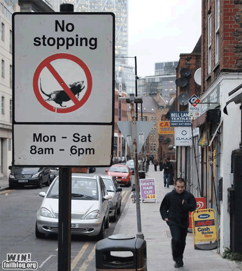 image of a street with an animated mouse running inside a wheel on a 'no stopping' sign